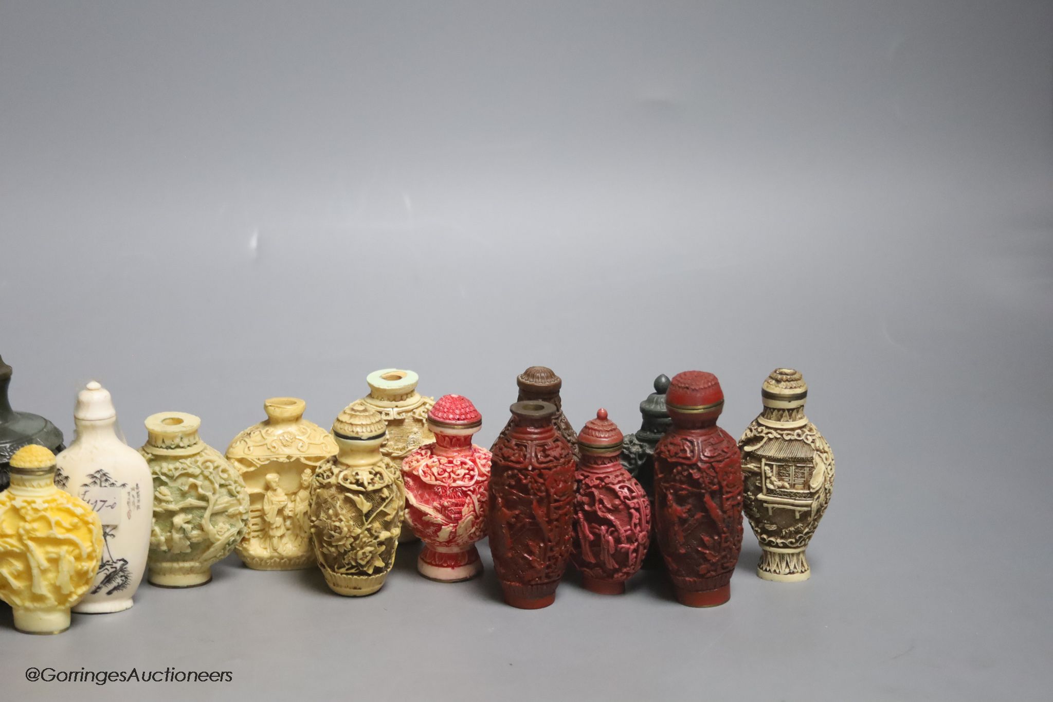 A large Chinese 20th century carved snuff bottle and smaller snuff bottles